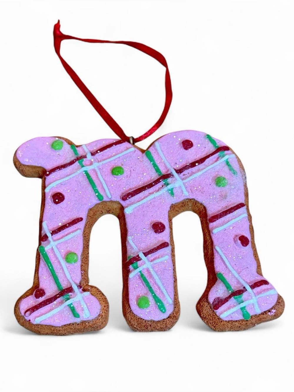 St. Nicholas Square Pink Gingerbread Letter “m” Ornament with Red Ribbon